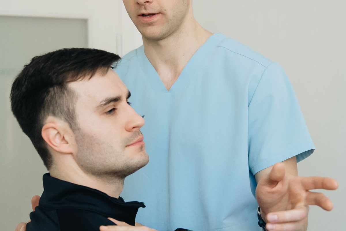 Physiotherapist working on a patient's arm during a treatment session
