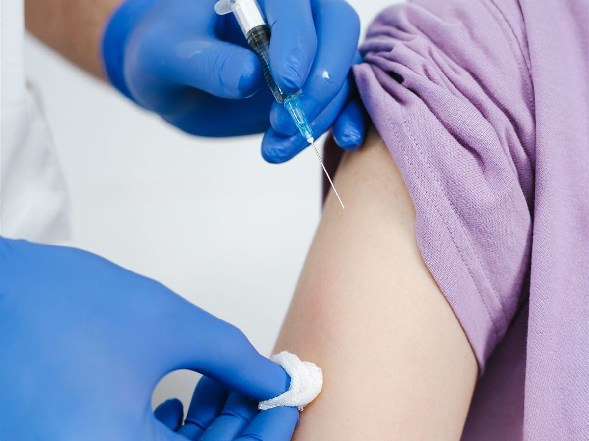 Clinic staff preparing a vaccination