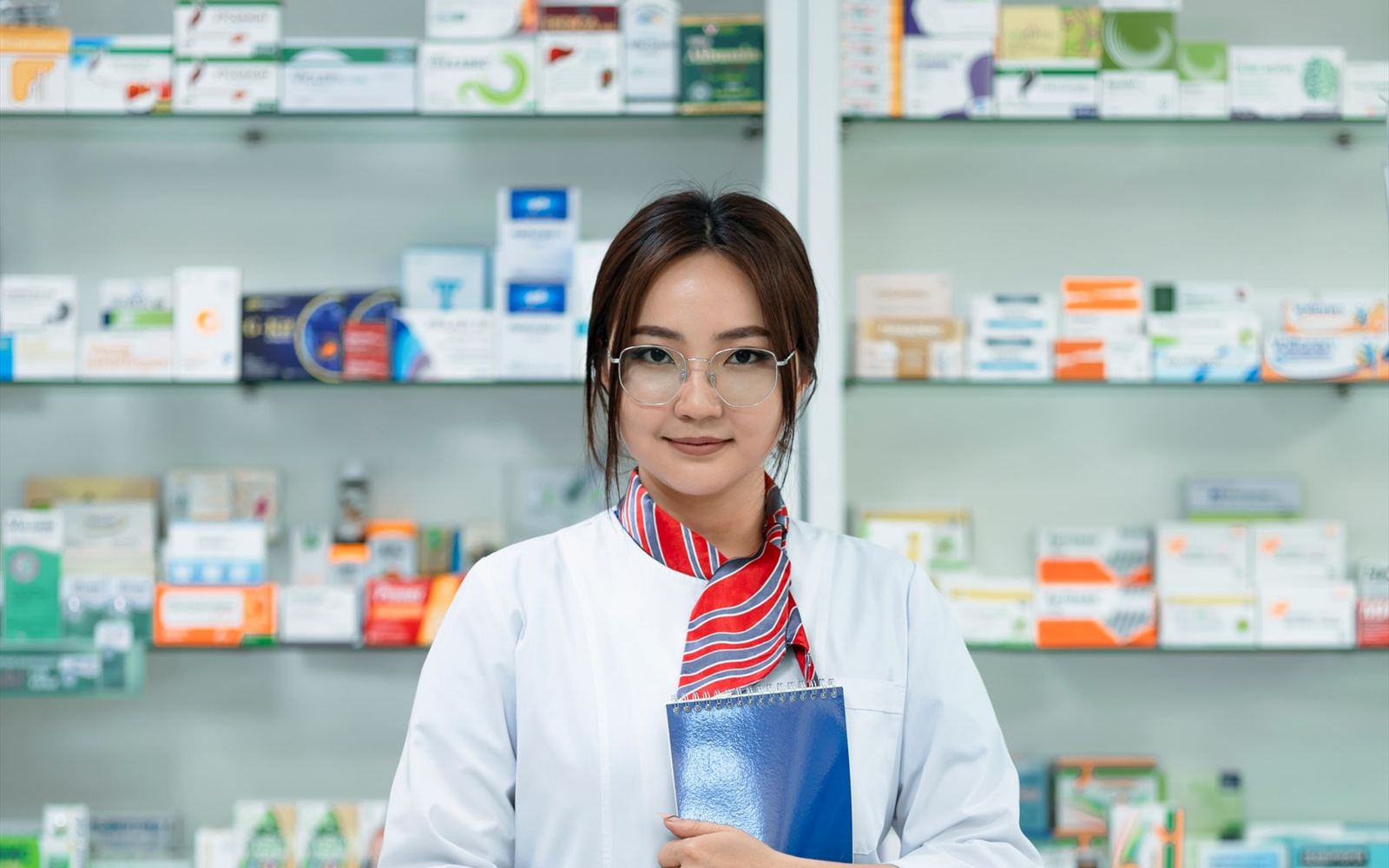 Shelves of medicine on a pharmacy shop floor