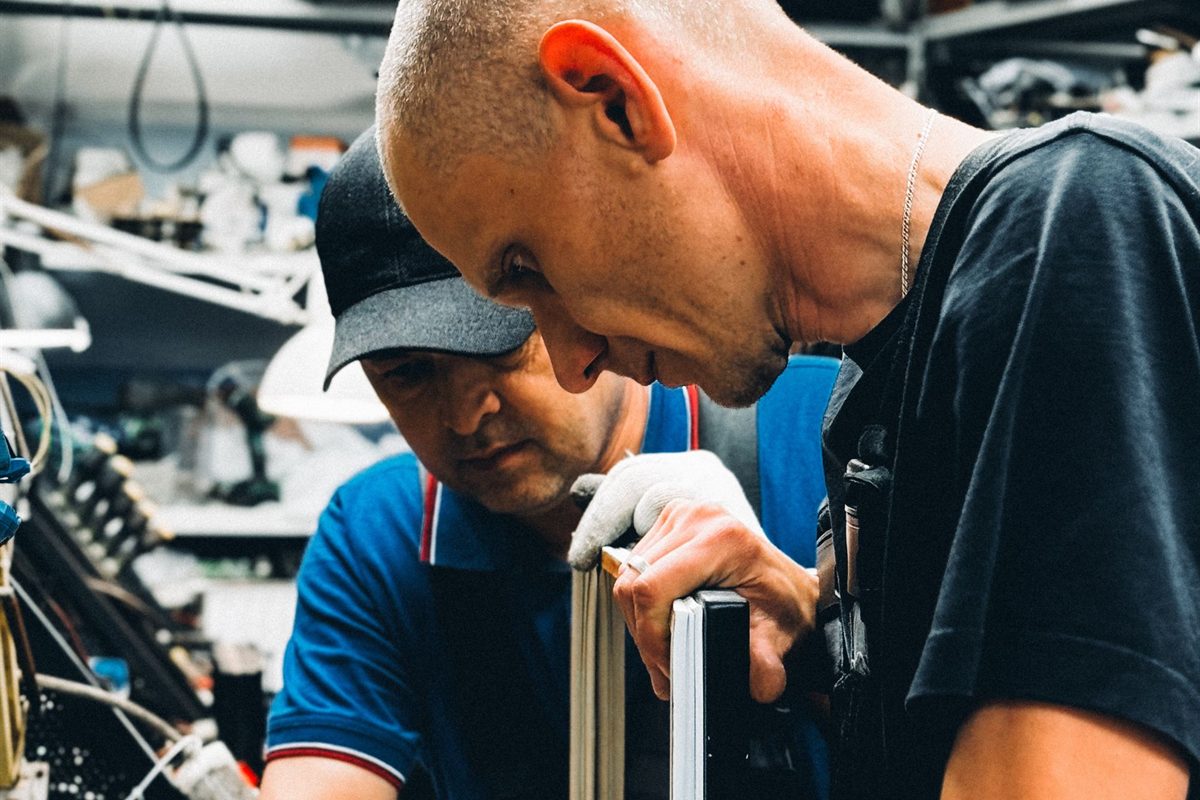 Two Waghuis technicians working on alarm equipment