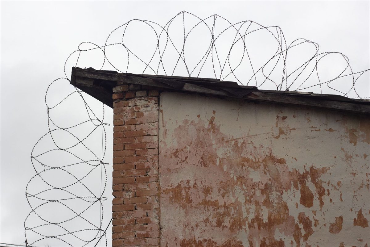 Coiled security wire along the top of a boundary wall