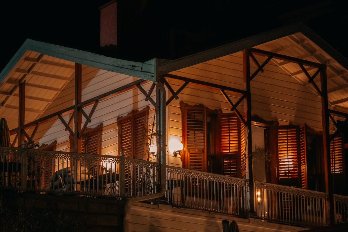 A home lit up at night with security lighting on