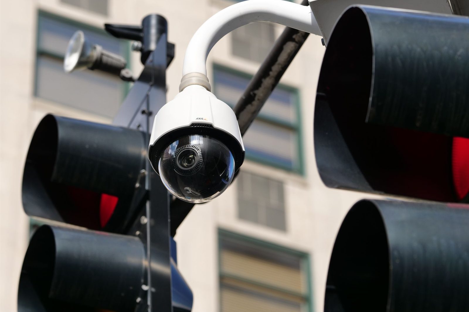 Surveillance camera mounted high on a building