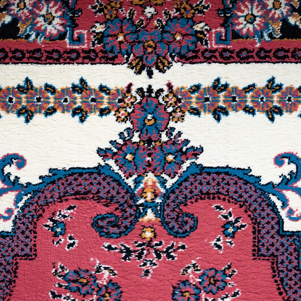 Kashan medallion rug in madder red and indigo