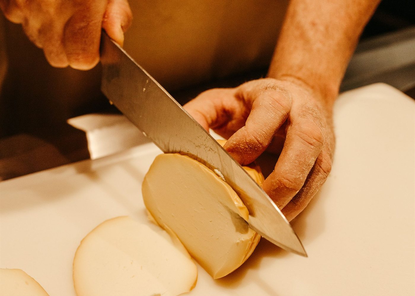 Cheese being cut at the provisions counter
