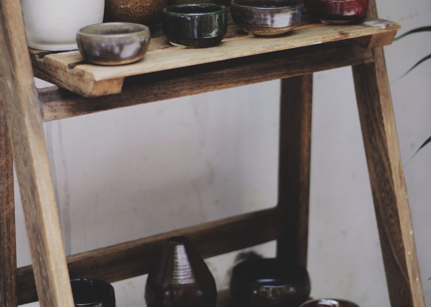 Pottery and ceramics on wooden shelving
