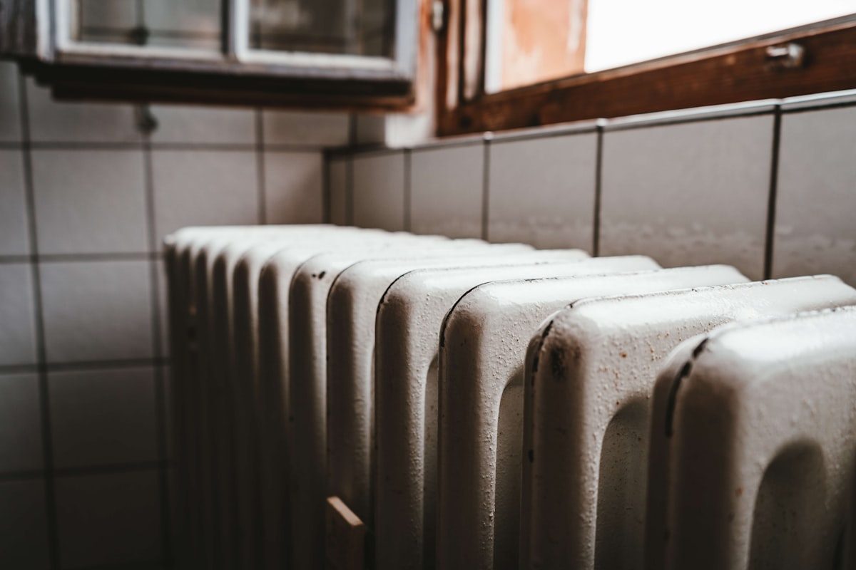 Cast-iron column radiator fitted beneath a window