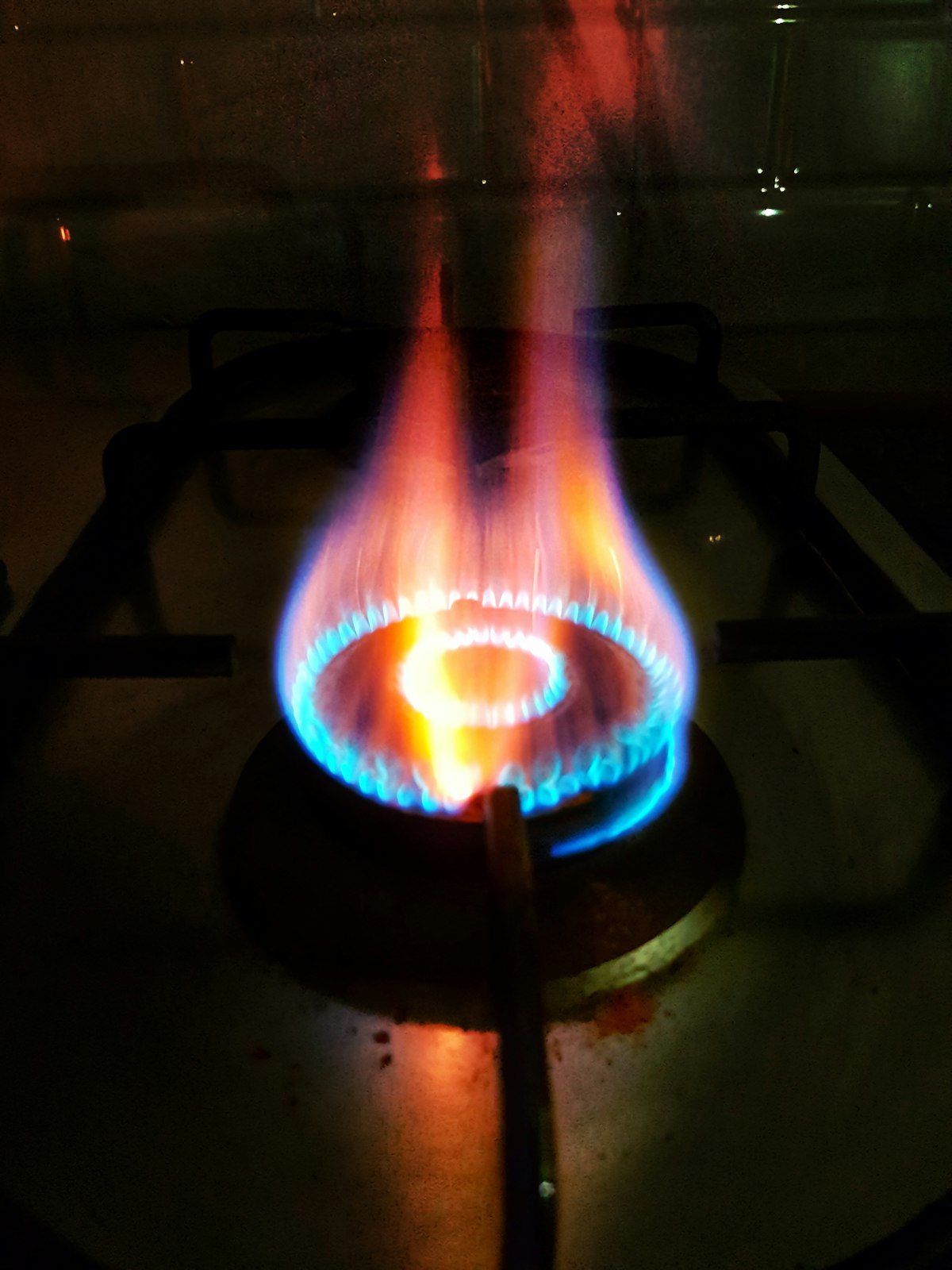 Gas burner flame representing boiler and heating work
