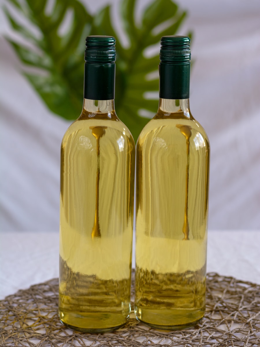 Two wine bottles standing together on a table