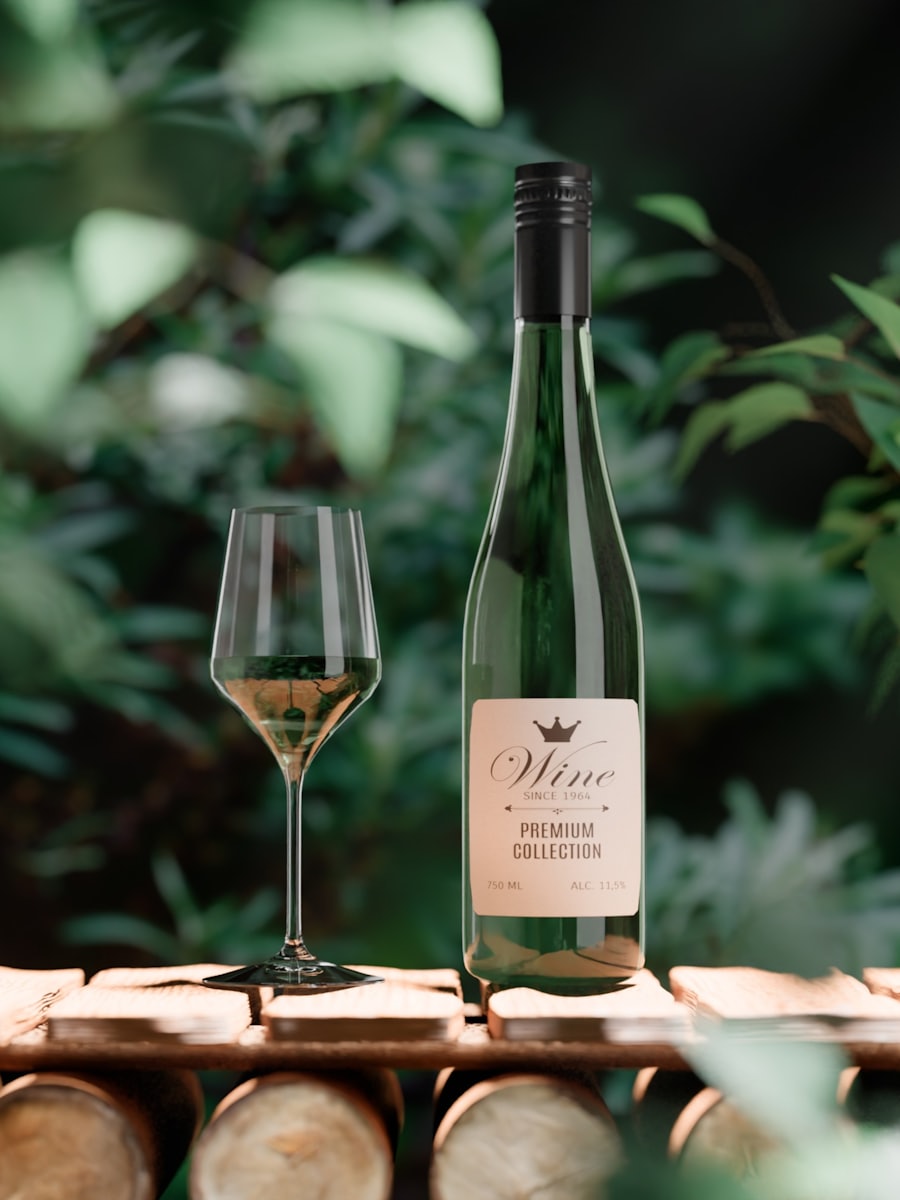 A bottle of white wine and a filled glass on a wooden table