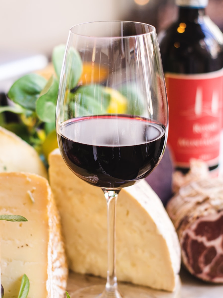 A long-stemmed glass filled with red wine
